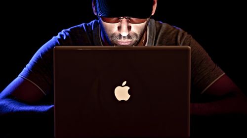 Hacker (Cropped, original by Christophe Verdier licensed CC-BY-NC)